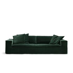 a green couch with three pillows on the back and one pillow on the side, in front of a white background