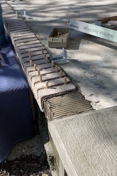 there are several pieces of wood on the bench