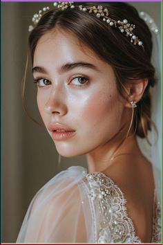 a woman wearing a tiara with pearls on her head