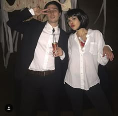 a man and woman dressed up for halloween