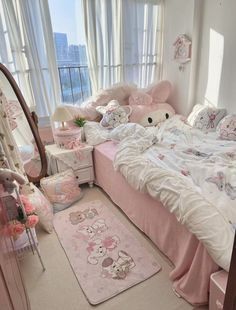 a bedroom decorated in pink and white with teddy bears on the bed, rugs and windows