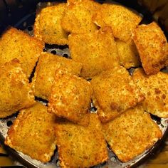 some fried food is cooking in a frying pan