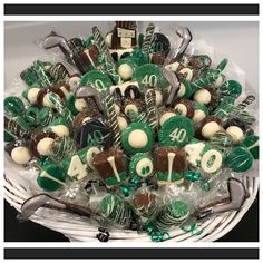 a basket filled with lots of green and white candies