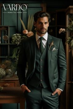 a man wearing a suit and tie standing in front of a shelf filled with flowers