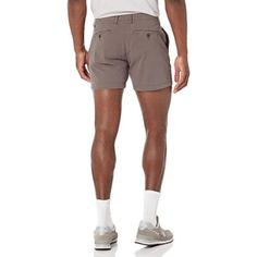 Upgrade your summer wardrobe with these sleek Slim Fit Flat Front Chino Shorts. Crafted from a soft and durable cotton blend with a touch of elastane, these shorts offer a comfortable fit with just the right amount of stretch. With a button closure and button-through back pockets, they are both stylish and functional. Details: 98% Cotton, 2% Elastane Button closure Machine Wash Fitted through hip and thigh, with a tapered leg. Sits below the waist Soft, durable cotton blend with a gentle stretch Cotton Bermuda Shorts With 5-inch Inseam For Summer, Casual Slim Fit Bottoms For Summer, Slim Fit Summer Shorts, Slim Fit Summer Bottoms Short Length, Summer Slim Fit Shorts, Casual Shorts With Comfort Stretch, Stretch Cotton Shorts With 5-inch Inseam, Casual 4-way Stretch Shorts, Summer Cotton Bermuda Shorts