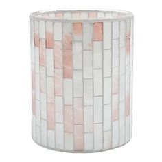 a white vase with pink and white tiles on it's sides, in the shape of a basket