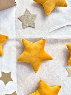 gold and silver stars on white paper