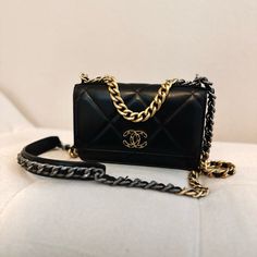 100% Authentic Chanel 19 Wallet On Chain In Black And Gold Hardware With Crossbody Strap Comes With Card Dustbag And Box. Bought In January 2023. Black With Red Interior Card Holders Chanel (Identification Is No Longer On A Card, It's Placed In The Bag) 7.5 X 4.7 X 1.6 Inches Sold Out Everywhere, Impossible To Find*** Barely Worn. Excellent Condition. Scuffs And Dust From Storage Will Be Cleaned/Wiped Prior To Shipment. The Bag Is From A Clean Owner Who Doesn’t Smoke And Collects Handbags. The Bag Is Well Stored And Cared Of With No Odors Or Damages. More Photos Can Be Requested, Feel Free To Send A Message :) Affordable Chanel Bag, Chanel 19 Wallet On Chain, Chanel Cross Body Bag, Black And Gold Hardware, Chanel 19, Chain Purse, Wallet On Chain, January 2023, Red Interior