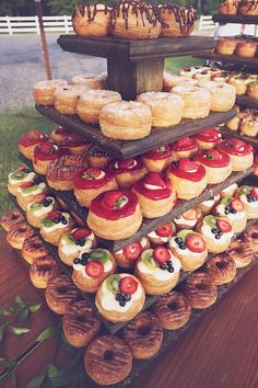 an assortment of pastries are displayed on a table