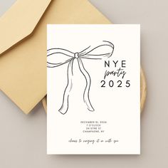 a new year's eve party card with a ribbon tied around the front and back