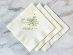 four personalized napkins on top of a marble table