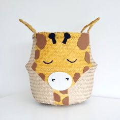 a basket with a giraffe face on it