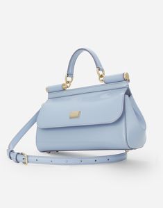 Medium Sicily handbag in polished calfskin: Light blue Front flap with hidden double magnetic fastening Branded tag featuring two metal plating finishes Top handle and adjustable, detachable strap in polished calfskin Printed fabric lining and flat pocket Item comes with a branded dust bag Measurements: H17 x W25 x D9 cm Made in Italy Trendy Handbags, Bag Measurements, Brand Tags, Printed Fabric, Top 100, Sicily, Blue Leather, Top Handle, Calf Skin