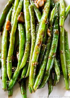 asparagus with garlic and seasoning on a white plate