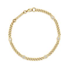 14k small hollow curb chain bracelet with five floating white diamonds set in the chain SPECIFICS • 14k small curb chain is fixed at 6.5 or 7" with a lobster clasp closure• chain is approx. 3mm wide• round diamonds are approx. 2.5mm • white diamonds .25 ctw• available in yellow gold only Curb Chain Bracelet, Jewelry Wardrobe, Zoe Chicco, Heavy Chain, Rings Jewelry Fashion, Ring Size Guide, Curb Chain, White Diamonds, Bracelet Sizes