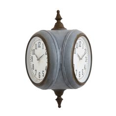 an old fashioned clock with two barrels on the front and sides, sitting against a white background