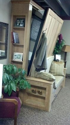 a living room filled with furniture and lots of storage