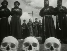 several skulls and people standing in front of a cross with their heads turned to the side