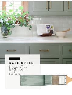 a kitchen with green cabinets and white counter tops