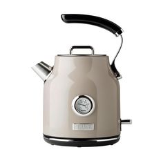 an electric kettle with a clock on the front and side handle, is shown against a white background