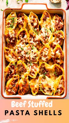 a casserole dish filled with beef stuffed pasta shells and topped with melted cheese