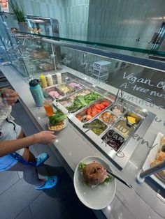 a person sitting at a counter with food on it