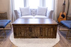 a living room filled with furniture and a wooden coffee table