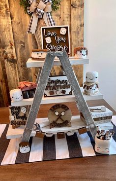 a wooden sign that says love you empire on top of a table with other items