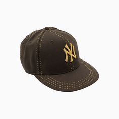 the new york yankees cap is shown in black with gold stitching on the front