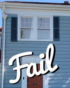 a blue house with the word fail painted on it