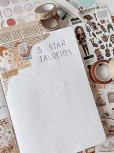 a notepad with the words 5 star favorites on it next to other items