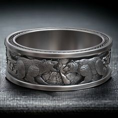 Unveil the spirit of the North with our Nordic Viking Polar Bear Wedding Band. Crafted from high-quality 925 Sterling Silver, this ring features a striking polar bear motif, symbolizing strength and resilience. Meticulously handcrafted, the unique design adds a touch of Nordic mystique to your wedding ensemble. Whether you're a nature enthusiast or someone captivated by Viking symbolism, this ring is a perfect choice. The bear, a symbol of courage, complements the commitment of a wedding band. Make a statement with this exceptional piece that celebrates love, wildlife, and the enduring spirit of the North. ⚜️ Package included: Unisex Silver Ring - Made to order ⚜️ Sizes: From 5 to 15 US ⚜️ Materials: 925 Sterling Silver / 10k Gold / 14k Gold / 18k Gold ⚜️ Finish: Oxidized Matte / Oxidized Bear Ring Jewelry, Viking Bear, Viking Wedding Ring, Bear Ring, Bear Wedding, Nature Enthusiast, Mens Band Rings, Nordic Vikings, Animal Symbolism