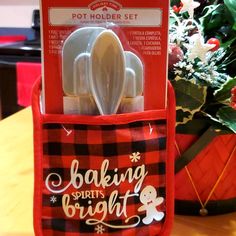 a set of kitchen utensils in a red bag with the words baking spirit's bright written on it