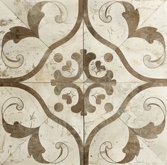 an artistic tile design with swirls and leaves on it's sides, in brown and white colors