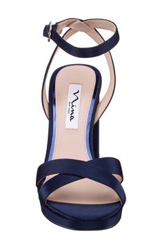 Crisscrossing vamp straps and a lustrous upper create modern allure on an elegant sandal lifted by a wrapped block heel. Adjustable ankle strap with buckle closure Synthetic upper and lining/leather sole Imported Formal Sandals With 4-inch Heel And Cross Strap, Cross Strap 4-inch Heels For Evening, Evening Cross Strap Heels With 4-inch Heel, Evening Heels With 4-inch Cross Strap, Evening Heels With 4-inch Heel And Cross Strap, Cross Strap Sandals With Heel Strap For Night Out, Elegant Cross Strap Sandals For Night Out, Chic Evening Sandals With Cross Strap, Formal Heels With Heel And Cross Strap