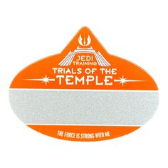 an orange and white sticker with the words trials of the temple on it