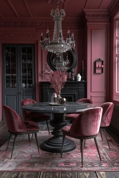 a dining room with pink chairs and a chandelier