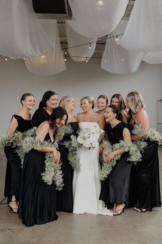 Baby's breath garlands as bridesmaid bouquets Floral Shawls black and white industrial modern romantic wedding at Glass House in Minneapolis Black Tie Wedding Flowers Bridesmaid Bouquets, Black And White Industrial Wedding, White And Grey Wedding Theme, Black And White Industrial, Grey Wedding Theme, Modern Romantic Wedding, Black And White Wedding Theme, Bridal Party Getting Ready, White Wedding Theme