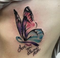 a woman's stomach with a colorful butterfly tattoo on her chest that says, love you always