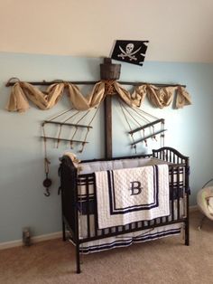 a baby crib with pirate themed decor