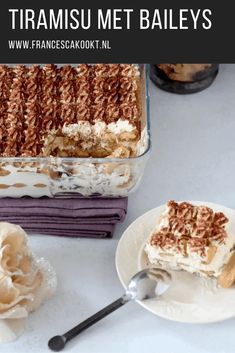 a close up of a piece of cake on a plate with a fork near it