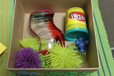 a box filled with toys on top of a table