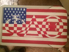 an american flag painted on the back of a suitcase with words ao and o written in white letters