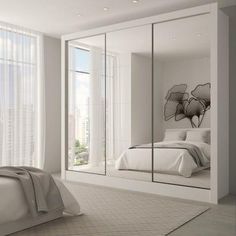 a bedroom with a large mirror on the wall and a bed in front of it