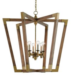 a chandelier with four lights hanging from it's center beam and wooden frame