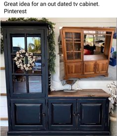 an old china cabinet is painted black and has been turned into a tv stand with glass doors