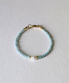 The stretch bracelet is made of light, pleasantly scented walnut beads (6 mm) and aqua chalcedony beads (5 mm). The gold beads are all 14 K.rose gold plated on brass. The bracelet is 17 cm. Long, can be made larger or smaller upon request. The 14 carat gold filling is about 100 times thicker than simple gold plating. The gold layer is mechanically bonded to the base material brass. Small inclusions, color deviations and irregularities on the pearls or even on the metals are part of the peculiari Jewellery Business, Aqua Chalcedony, Fancy Jewelry, Macrame Diy, Gold Beads, Stretch Bracelet, Bead Bracelet, Stretch Bracelets, Gold Plating