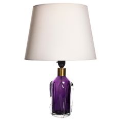 Vintage Orrefors Table Lamp, 1960s This elegant table lamp by Orrefors, crafted in the 1960s, features a striking combination of purple and clear glass. The base showcases a vibrant purple glass core encased in clear glass with artistic wave-like details. Topped with a brass fitting, this lamp exudes mid-century modern charm. Please note, the lampshade is not included. The lamp is in excellent vintage condition, adding a touch of color and sophistication to any room. Elegant Table Lamp, Table Vintage, Vibrant Purple, Brass Fittings, Purple Glass, The 1960s, Elegant Table, Table Lamp Lighting, Clear Glass