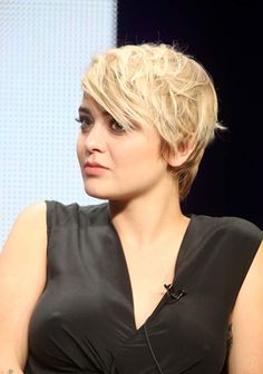 a close up of a person sitting at a table