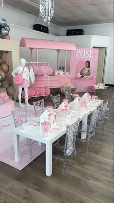 a table set up for a ballerina themed birthday party with pink and white decor